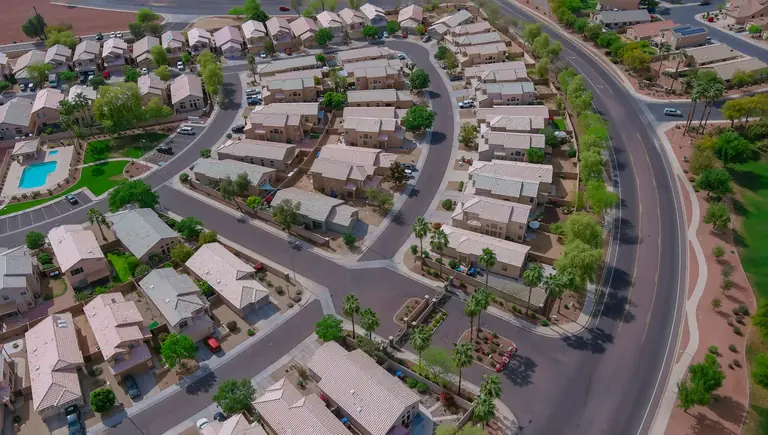 Aerial view of residential rooftops and streets