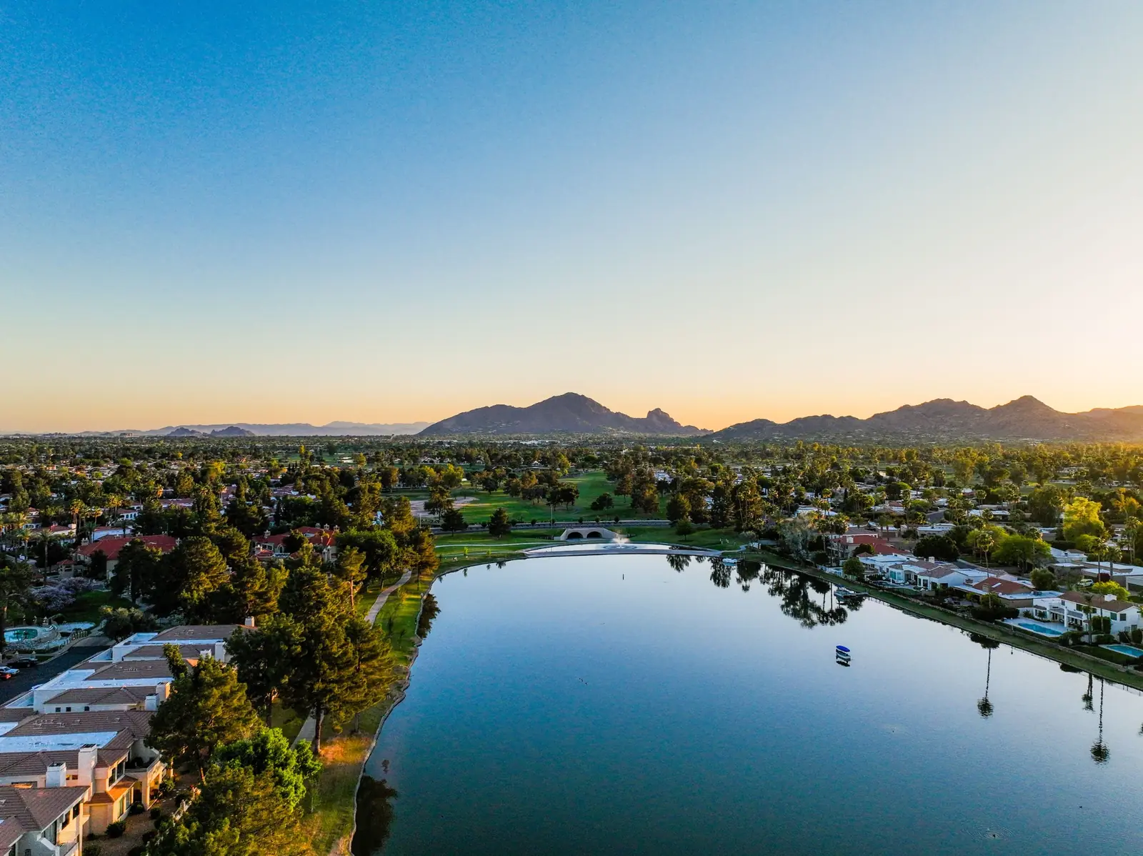 Lake and neighborhoods in Scottsdale at sunset